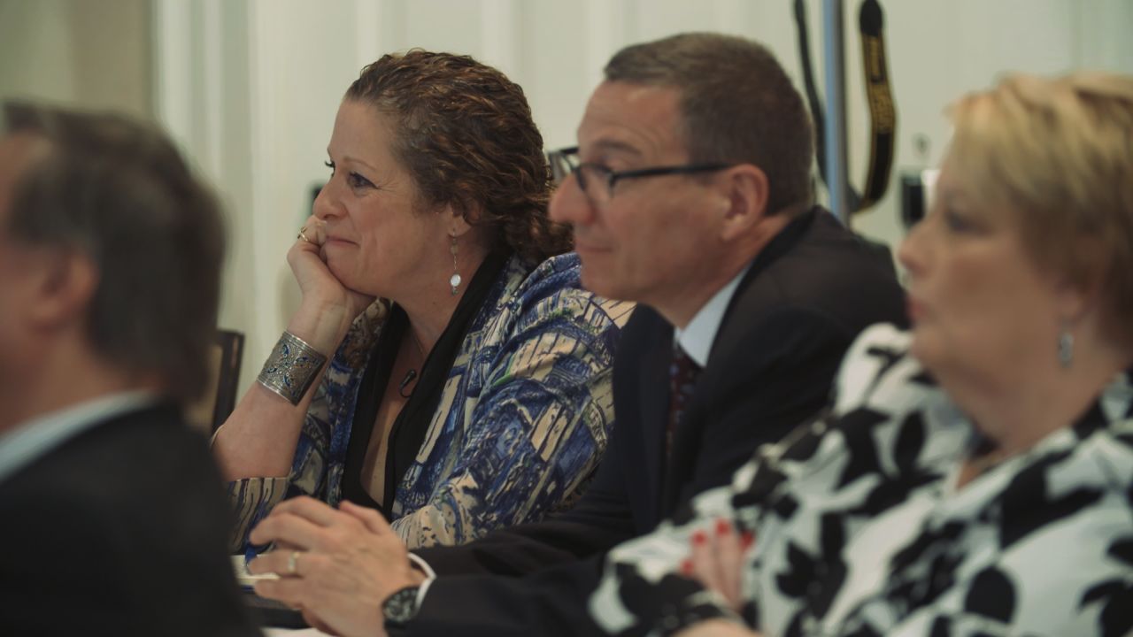 Abigail Disney and Rob Schenck listen to a panel discussing gun violence at the event "The Gospel and a Sidewarm," hosted by the Dietrich Bonhoeffer Institute.