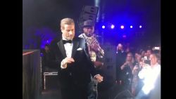 John Travolta joined 50 Cent onstage during a performance at Cannes Film Festival and showed off his dance moves.
