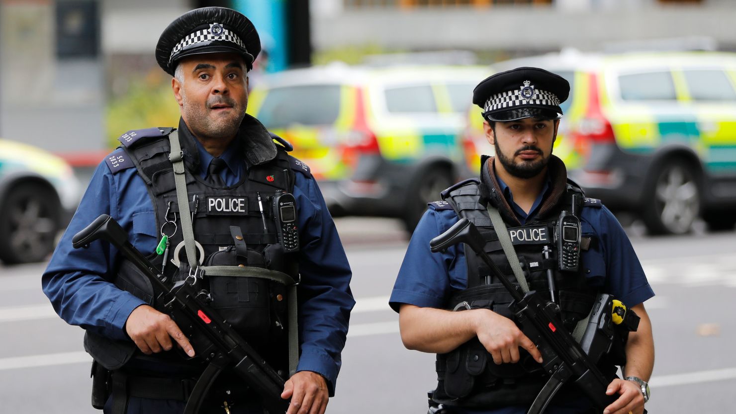 Armed police officers stand on duty following an incident in London in October.