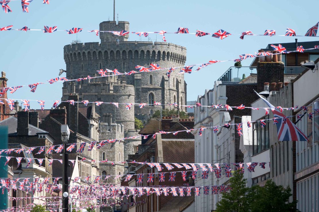 Union flags are displayed in the street in front of Windsor Castle ahead of the royal wedding.