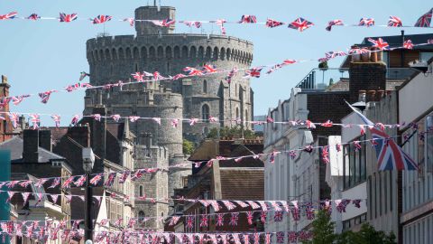 Union flags are displayed in the street in front of Windsor Castle ahead of the royal wedding.