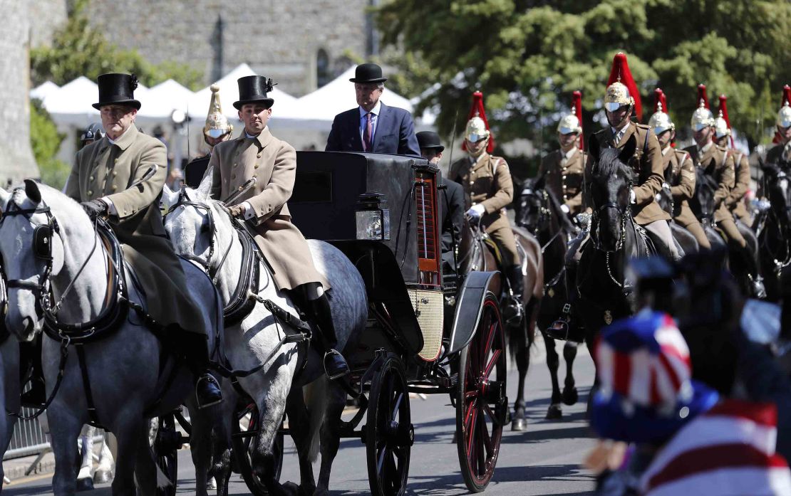 Mounted members of the Household Cavalry escort the carriage through Windsor in the parade rehearsal. 