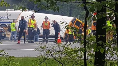 Emergency crews evaluate the scene of a school bus crash in Mount Olive Township, New Jersey, on May 17.