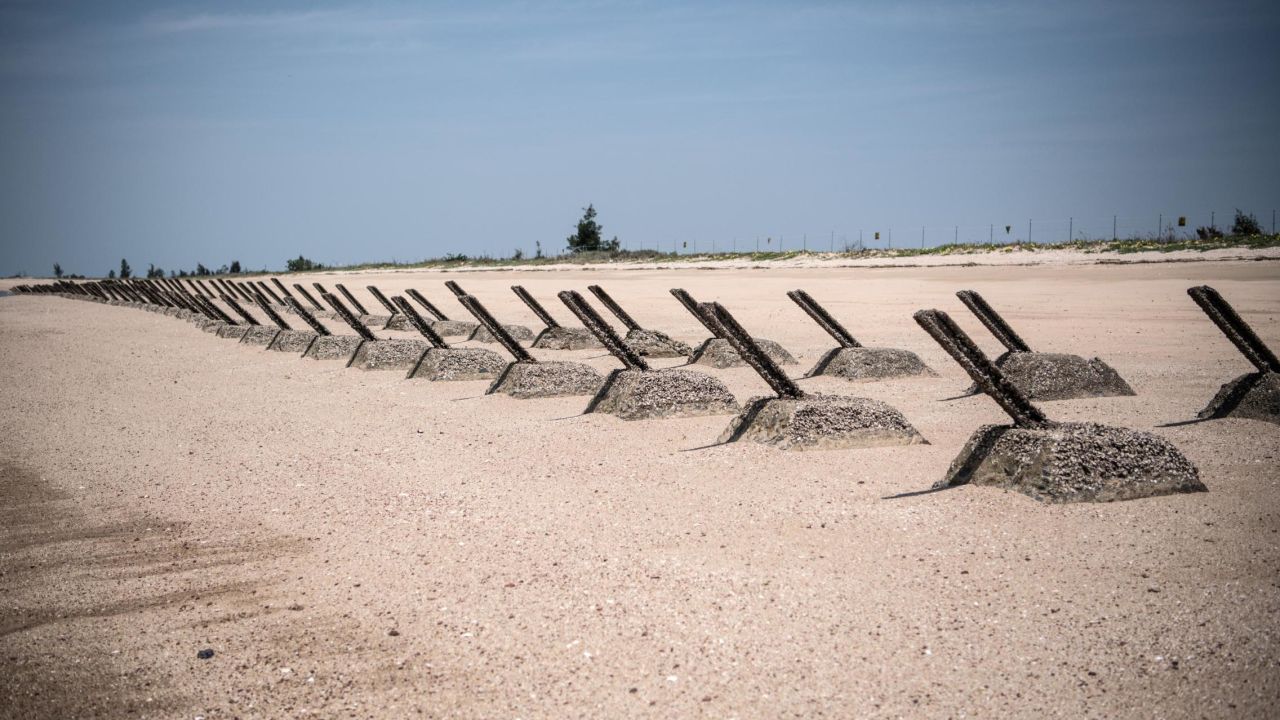 Aged anti-landing barricades are positioned on a beach facing China on the Taiwanese island of Kinmen which, at points lies only a few miles from China.