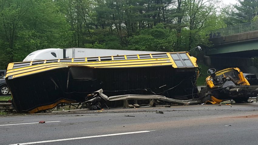This photo shows an overturned school bus after it collided with a dump truck, injuring multiple people, on Interstate 80 in Mount Olive, N.J., Thursday, May 17, 2018. (Chrissy Oleszek via AP)