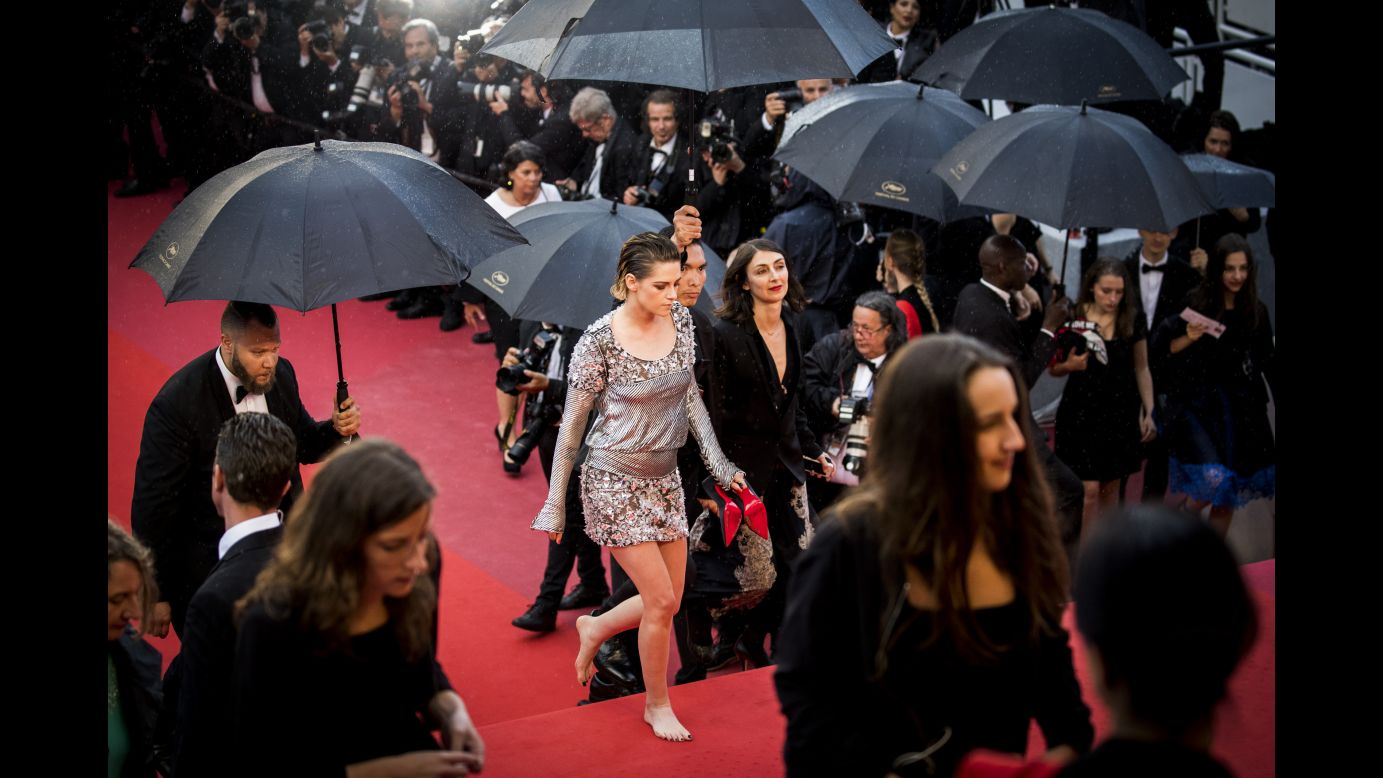 Actress Kristen Stewart walks barefoot during a red-carpet event at the Cannes Film Festival on Monday, May 14.