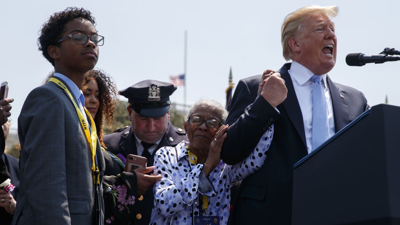 Adrianna Valoy, the mother of slain New York Police Detective Miosotis Familia, holds hands with US President Donald Trump as he speaks during the 37th annual National Peace Officers' Memorial Service on Tuesday, May 15. <a href="https://www.cnn.com/2018/05/15/politics/trump-national-peace-officers-memorial/index.html" target="_blank">Trump honored the sacrifices of police officers killed in the line of duty,</a> calling them "among the bravest Americans to ever live," and he vowed that his administration has a clear policy: "We will protect those who protect us." He told <a href="https://www.cnn.com/2017/07/11/us/new-york-police-officer-funeral/index.html" target="_blank">Familia's story</a> during his speech and called her family up to the stage. 