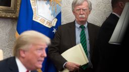 National Security Adviser John Bolton stands alongside US President Donald Trump as he speaks during a meeting with NATO Secretary General Jens Stoltenberg in the Oval Office of the White House in Washington, DC, May 17, 2018. (Photo by SAUL LOEB / AFP)        (Photo credit should read SAUL LOEB/AFP/Getty Images)