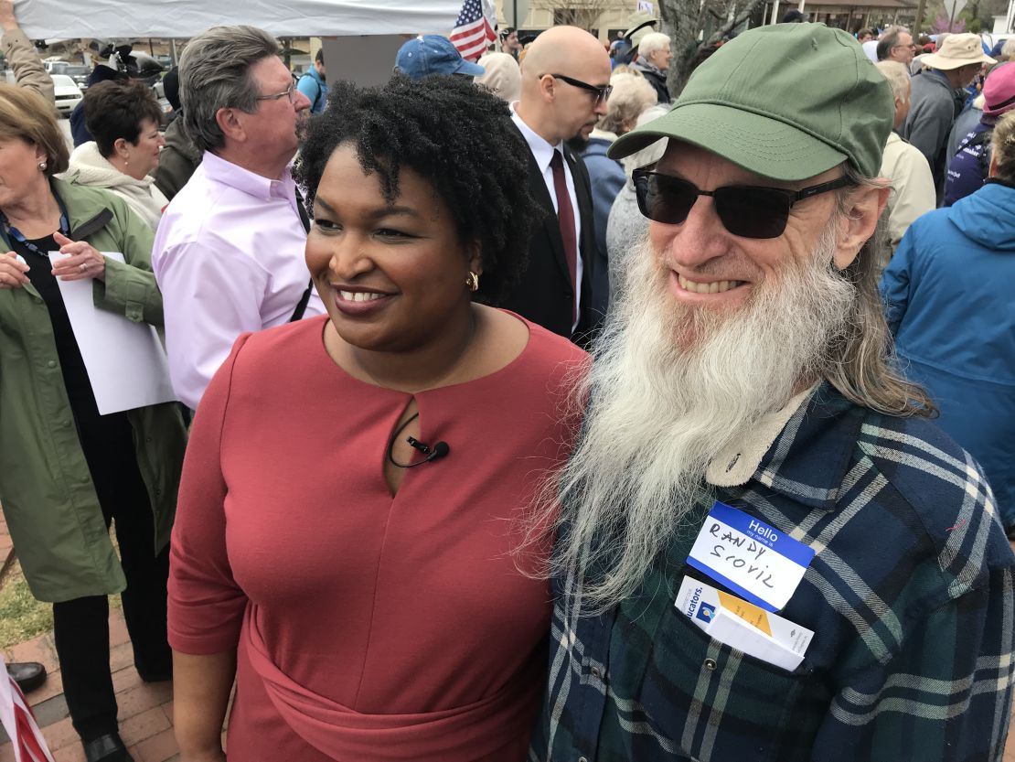 Stacey Abrams, here with a supporter in Dahlonega, Georgia, says she has to run an "authentic campaign."