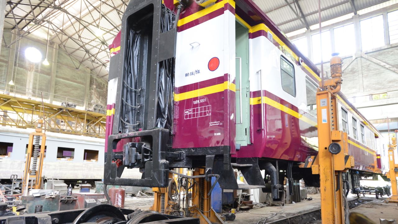 <strong>New again: </strong>Hoists lift refurbished passenger cars for new wheels to be attached.  