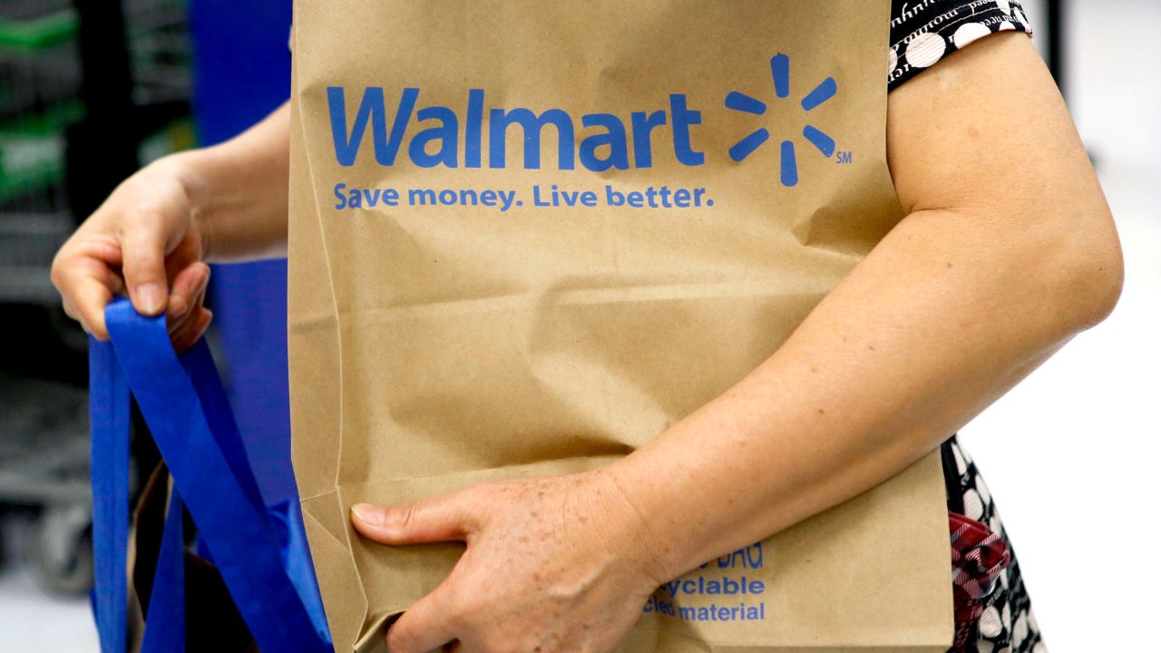 CHICAGO, IL - AUGUST 15: The Walmart logo is displayed on a shopping cart at a Walmart store on August 15, 2013 in Chicago, Illinois. Walmart, the world's largest retailer, reported a surprise decline in second-quarter same-store sales today. The retailer also cut its revenue and profit forecasts for the fiscal year.  (Photo by Scott Olson/Getty Images)