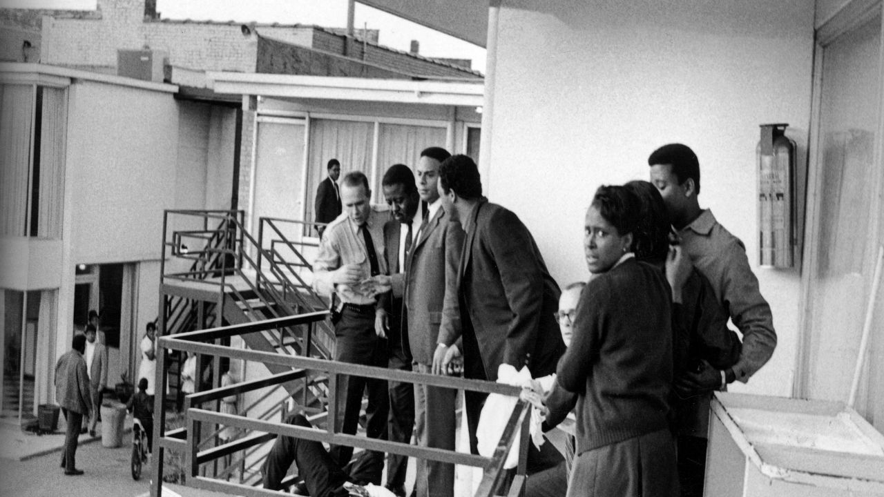 Police stand with civil rights leaders Ralph Abernathy (2L) (1929 - 1990), Andrew Young (3L), and Jesse Jackson (4L), and others on the balcony of the Lorraine Motel over body of slain American civil rights leader Dr. Martin Luther King, Jr. (1929 - 1968) following his assassination, Memphis, Tennessee, April 4, 1968. (Photo by Joseph Louw/The LIFE Images Collection/Getty Images)