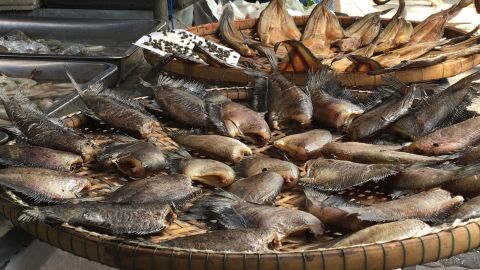 Dried fish for sale in the local market that fronts the Makkasan train station. 