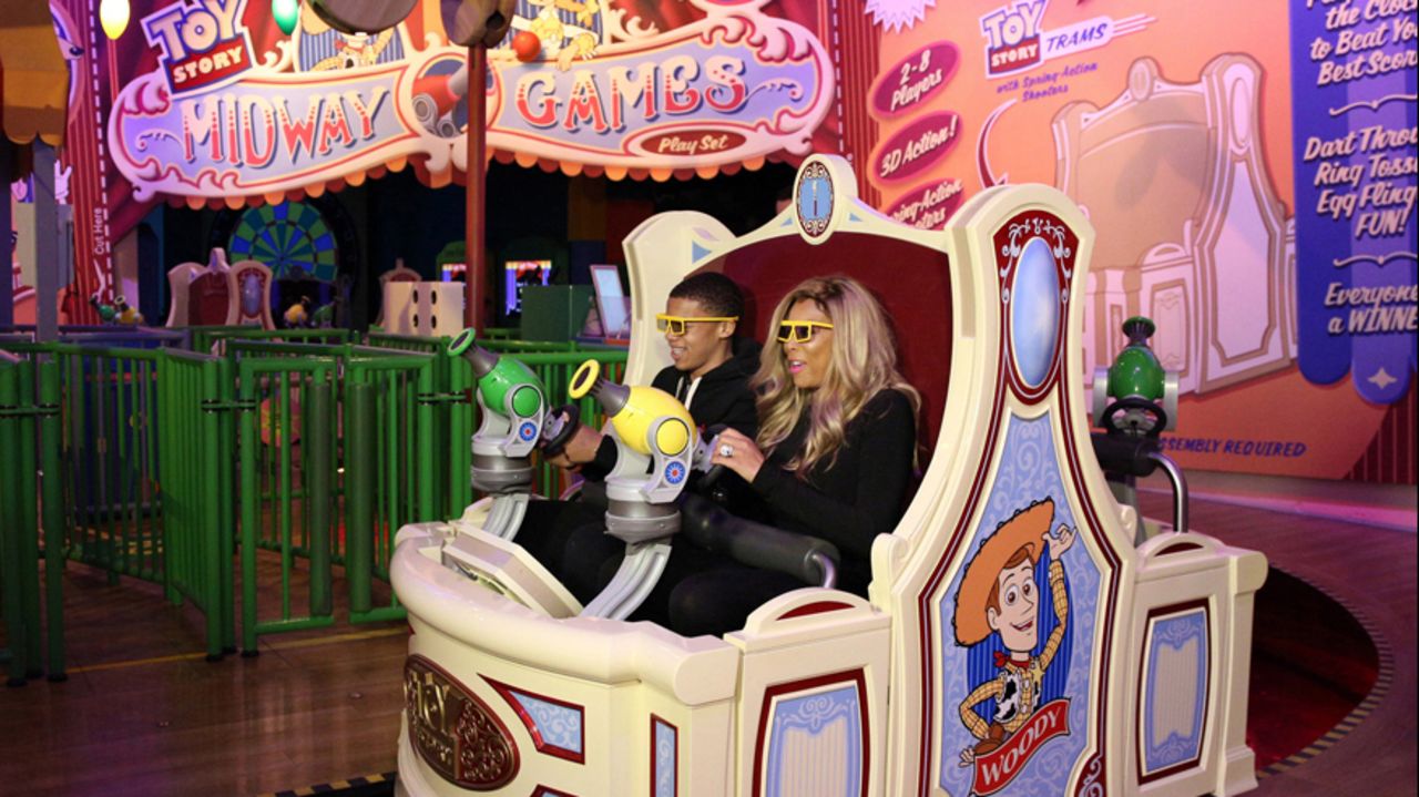 <strong>9. Disney's Hollywood Studios, Florida: </strong>Daytime TV talk show host Wendy Williams and her son Kevin ride Toy Story Midway Mania! at Disney's Hollywood Studios theme park at Orlando's Walt Disney World Resort.
