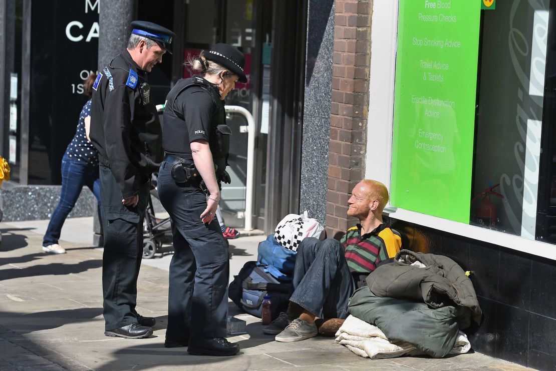A police officer talks to a homeless man in Windsor on May 17, 2018, two days before the royal wedding.