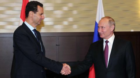 Russian President Vladimir Putin shakes hands with his Syrian counterpart Bashar al-Assad during their meeting in Sochi Thursday.