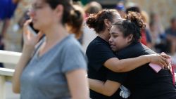 Santa Fe High School junior Guadalupe Sanchez, 16, cries in the arms of her mother, Elida Sanchez, after reuniting with her at a meeting point at a nearby Alamo Gym fitness center following a shooting at Santa Fe High School in Santa Fe, Texas, on Friday, May 18, 2018. (Michael Ciaglo/Houston Chronicle via AP)
