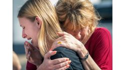 Santa Fe High School student Dakota Shrader is comforted by her mother Susan Davidson following a shooting at the school on Friday, May 18, 2018, in Santa Fe, Texas. Shrader said her friend was shot in the incident.  (Stuart Villanueva/The Galveston County Daily News via AP)