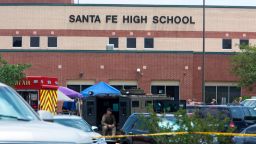 Emergency crews gather in the parking lot of Santa Fe High School where at least ten people were killed on May 18, 2018 in Santa Fe, Texas. - At least ten people were killed when a student opened fire at his Texas high school on May 18, 2018, as President Donald Trump expressed "heartbreak" over the latest deadly school shooting in the United States. The shooting took place as classes were beginning for the day at Santa Fe High School in the city of the same name, located about 30 miles (50 kilometers) southeast of Houston."There are multiple fatalities," Harris County Sheriff Ed Gonzalez told reporters. "There could be anywhere between eight to 10, the majority being students." (Photo by Daniel KRAMER / AFP)        (Photo credit should read DANIEL KRAMER/AFP/Getty Images)