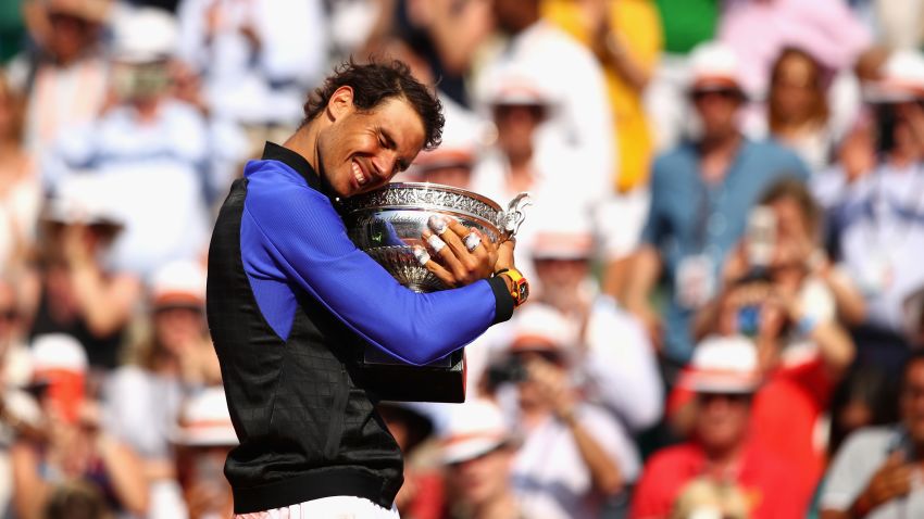 PARIS, FRANCE - JUNE 11:  Rafael Nadal of Spain celebrates victory with the trophy following the mens singles final against Stan Wawrinka of Switzerland on day fifteen of the 2017 French Open at Roland Garros on June 11, 2017 in Paris, France.  (Photo by Clive Brunskill/Getty Images)
