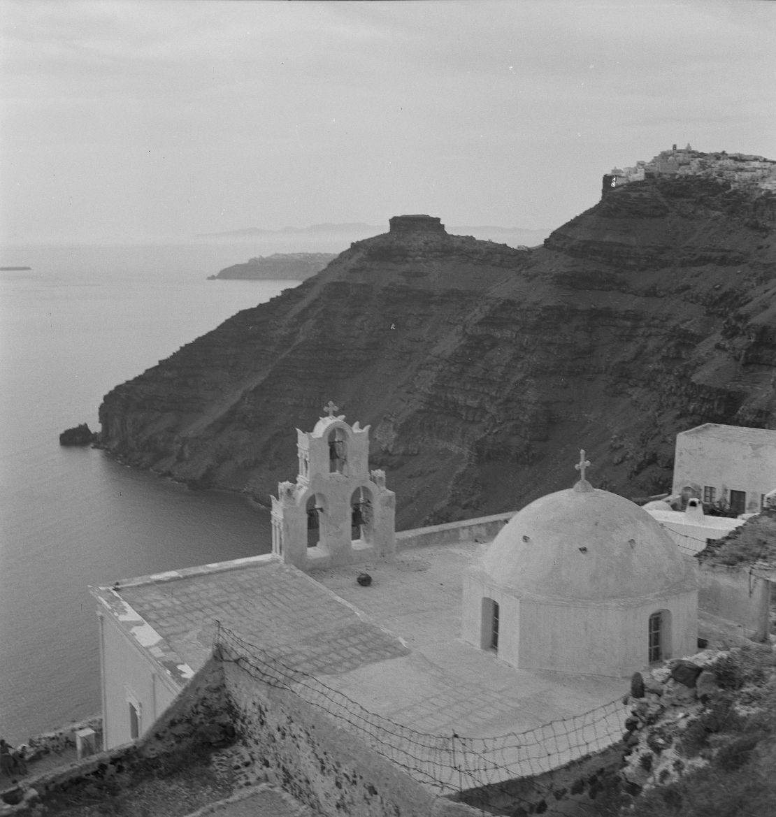 A view of a church overlooking the sea.