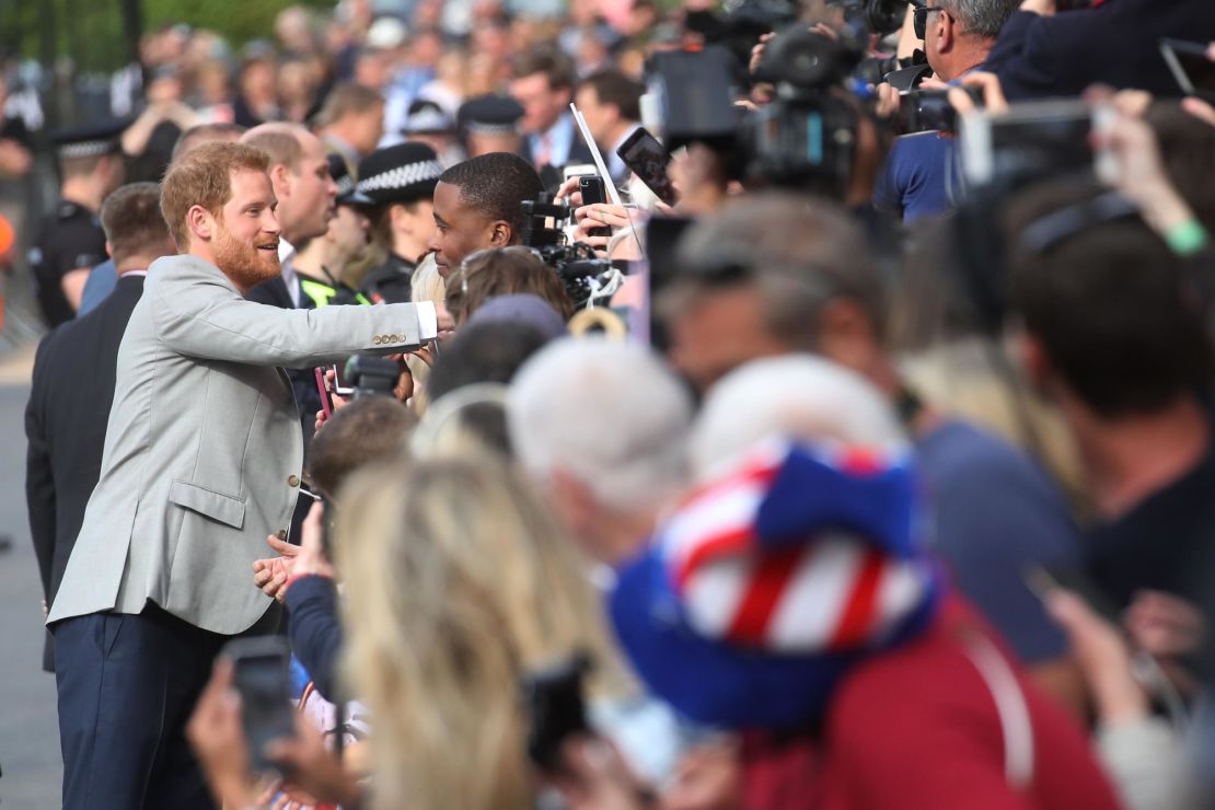 Prince Harry greets members of the public on Friday evening. 