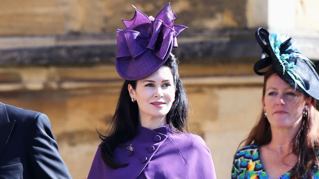 Karen Spencer the wife of Charles Spencer, 9th Earl Spencer, arrived in a violet contemporary fascinator -- adorned with abstract bows. 
