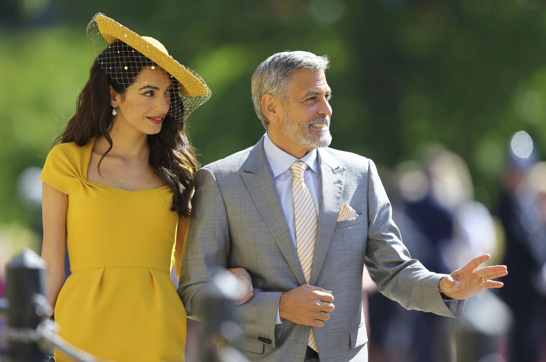 Amal Clooney wore Stella McCartney as she arrived with husband George Clooney for the wedding ceremony Saturday morning.
