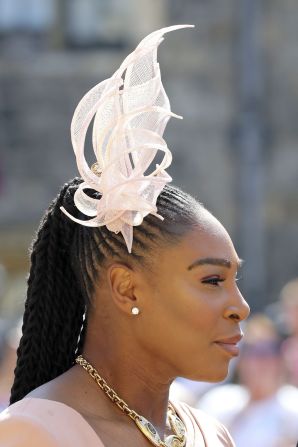 Serena Williams, a close friend of Meghan Markle wore a delicate and seasonal ruffled fascinator matched perfectly with her long sleeved pink Versace dress. "The dress is the perfect foil to a tall and imposing sculptural headpiece," fashion commentator Caryn Franklin says.