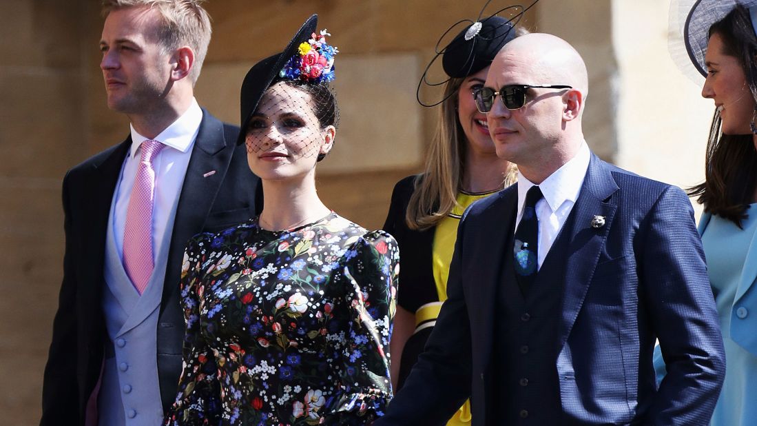 Charlotte Riley, wearing The Vampire's Wife, and Tom Hardy arrive for the wedding ceremony.