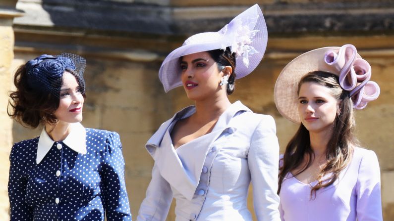 Actresses Abigail Spencer and Priyanka Chopra arrive wearing shades of blue and purple -- popular spring-time colors at this year's royal wedding.