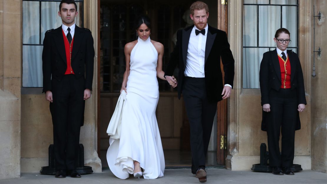 The newly married Duke and Duchess of Sussex, Meghan Markle and Prince Harry, leave Windsor Castle for an evening reception.