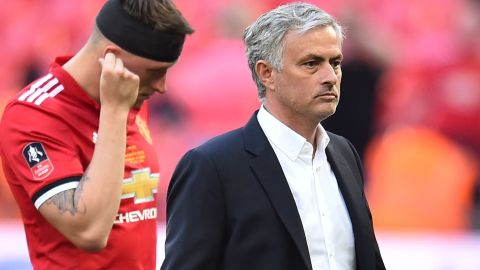 Manchester United's Portuguese manager Jose Mourinho and defender Phil Jones cut dejected figures after the final defeat at Wembley.