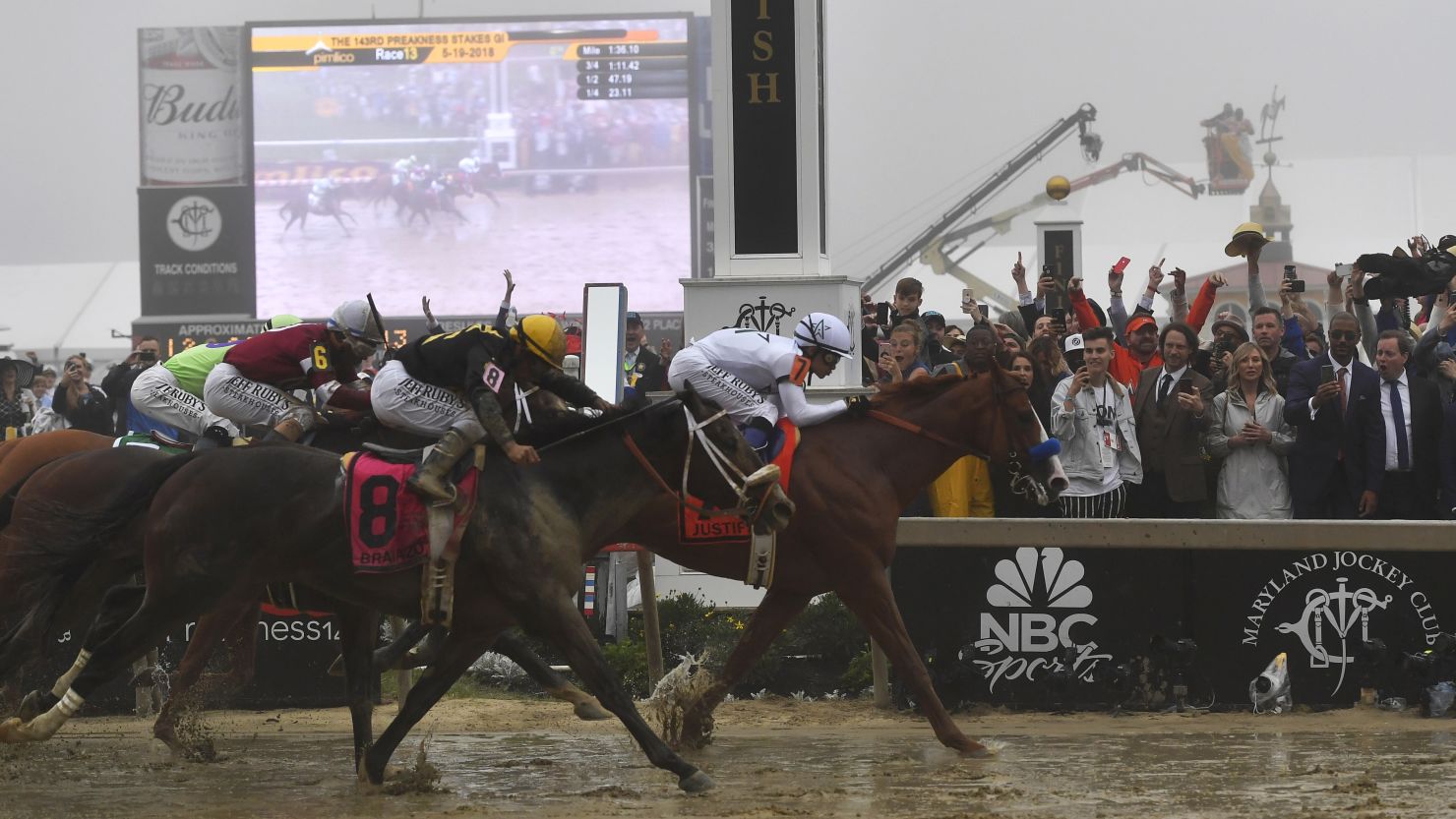 Justify beats Bravazo to the finish line by a half-length in Saturday's Preakness Stakes. 