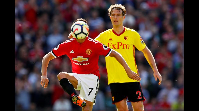 Manchester United's Alexis Sanchez in action with Watford's Daryl Janmaat in Manchester, England on Sunday, May 13. 