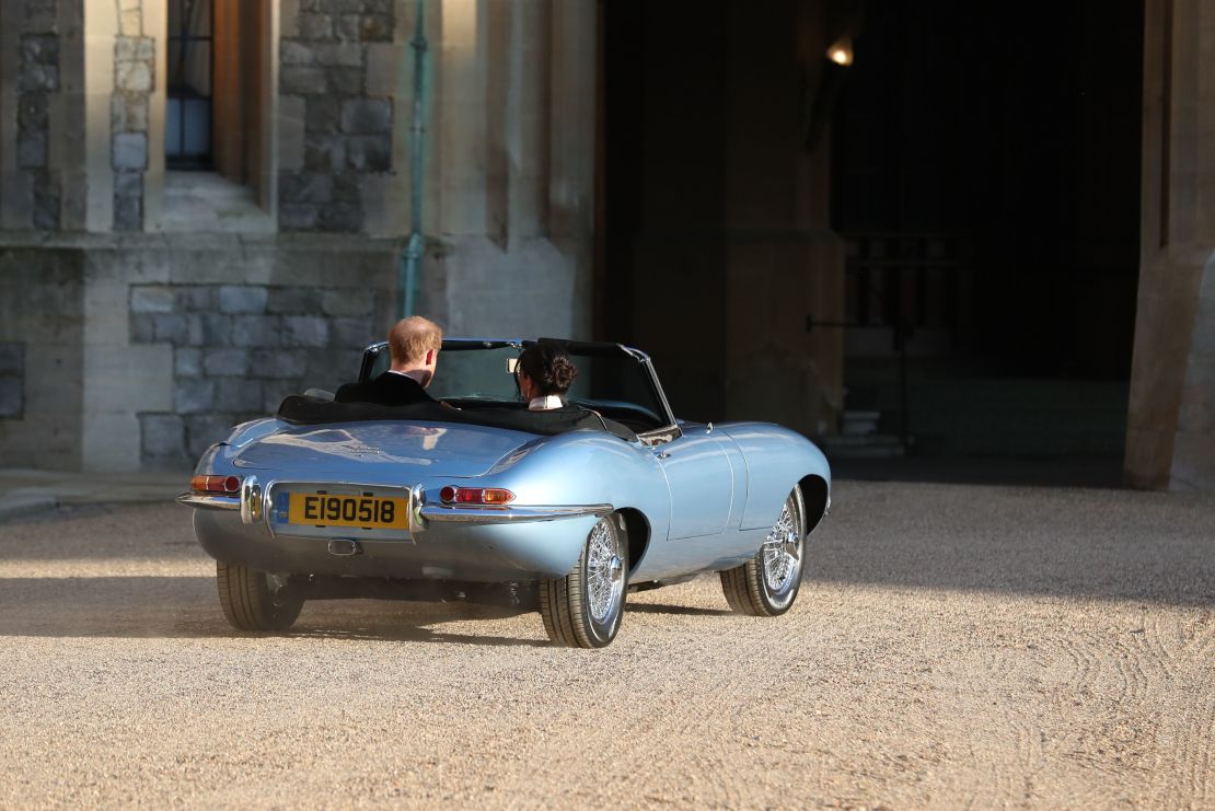 The Duke and Duchess of Sussex leave Windsor Castle in an E-Type Jaguar. The registration plate bore the date of their wedding day.