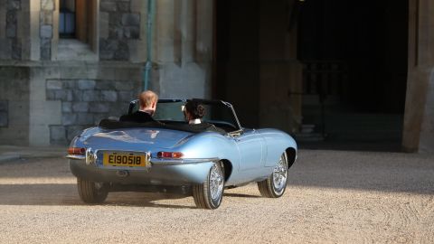 The Duke and Duchess of Sussex leave Windsor Castle in an E-Type Jaguar. The registration plate bore the date of their wedding day. 