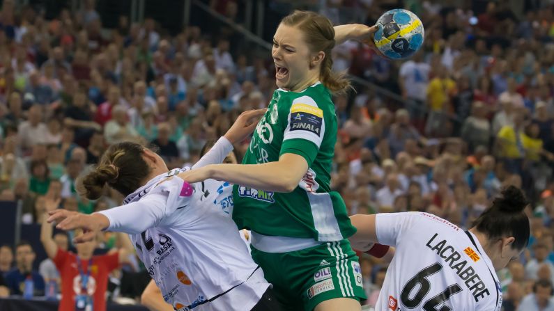 Anne Mette Hansen, center, of Gyori Audi ETO KC of Hungary tries to score a goal against Dragana Cvijic, left, and Alexandra Lacrabere of HC Vardar of Macedonia during the final of EHF Women's Champions League Final Four competition at the Papp Laszlo Sports Arena in Budapest, Hungary, on Sunday, May 13. Gyori Audi ETO KC beat Macedonia's HC Vardar 27-26 in the final handball match.