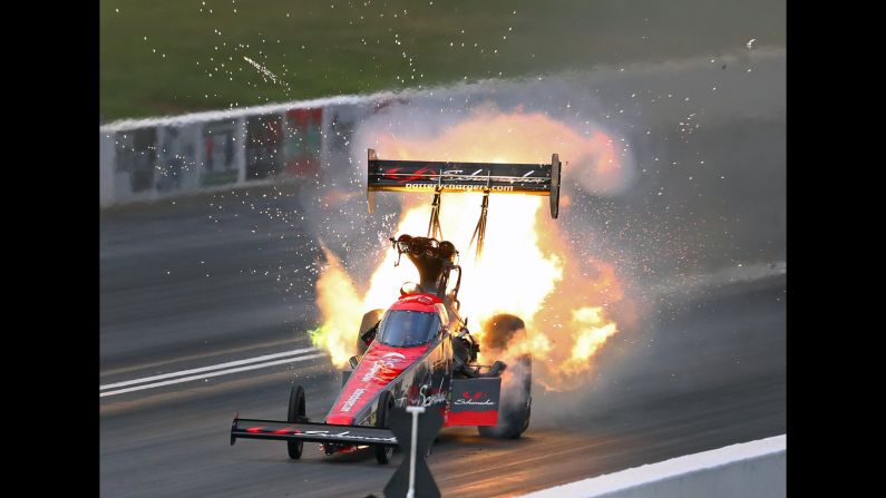 Top fuel driver Leah Pritchett's dragster engine catches fire during qualifying for the Heartland Nationals at Heartland Motorsports Park on Friday, May 18, in Topeka, Kansas.