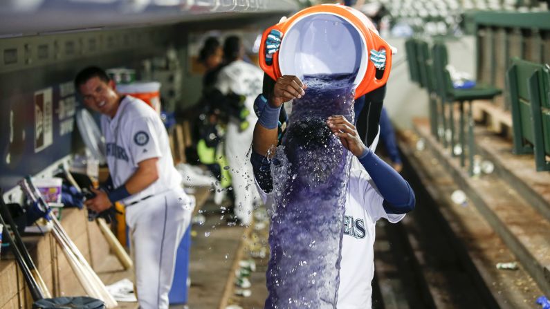 Seattle Mariners left fielder Guillermo Heredia is doused after a game-winning hit against the Texas Rangers in Seattle on Tuesday, May 15. 
