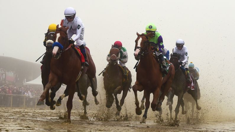 Justify, ridden by Mike E. Smith, <a href="index.php?page=&url=https%3A%2F%2Fwww.cnn.com%2F2018%2F05%2F19%2Fsport%2Fpreakness-stakes-justify%2Findex.html" target="_blank">wins the 143rd Preakness Stakes</a> in the mud and fog on Saturday, May 19, to capture the second leg of the Triple Crown in Baltimore.