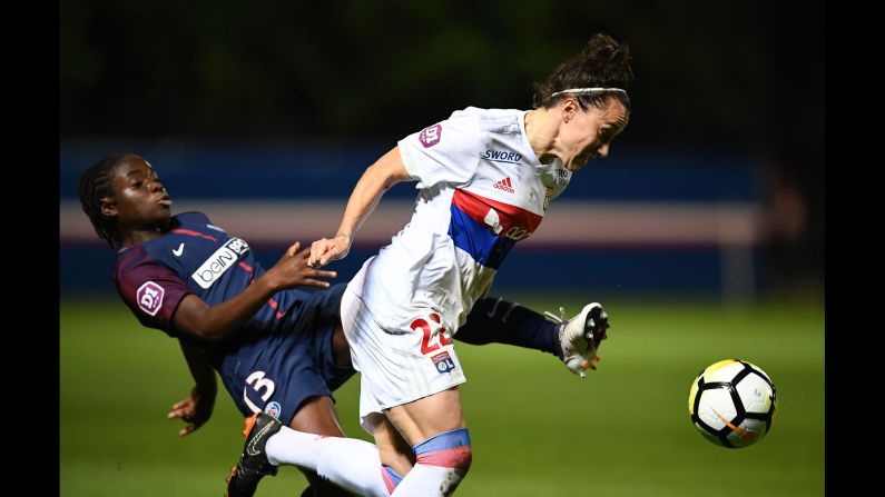 Lyon's English defender, Lucy Bronze, right, fights for the ball with Paris Saint-Germain's French midfielder Cathy Couturier during the French D1 women's football match between Paris Saint-Germain and Lyon at the Georges Lefèvre stadium in Saint Germain en Laye on Friday, May 18. 