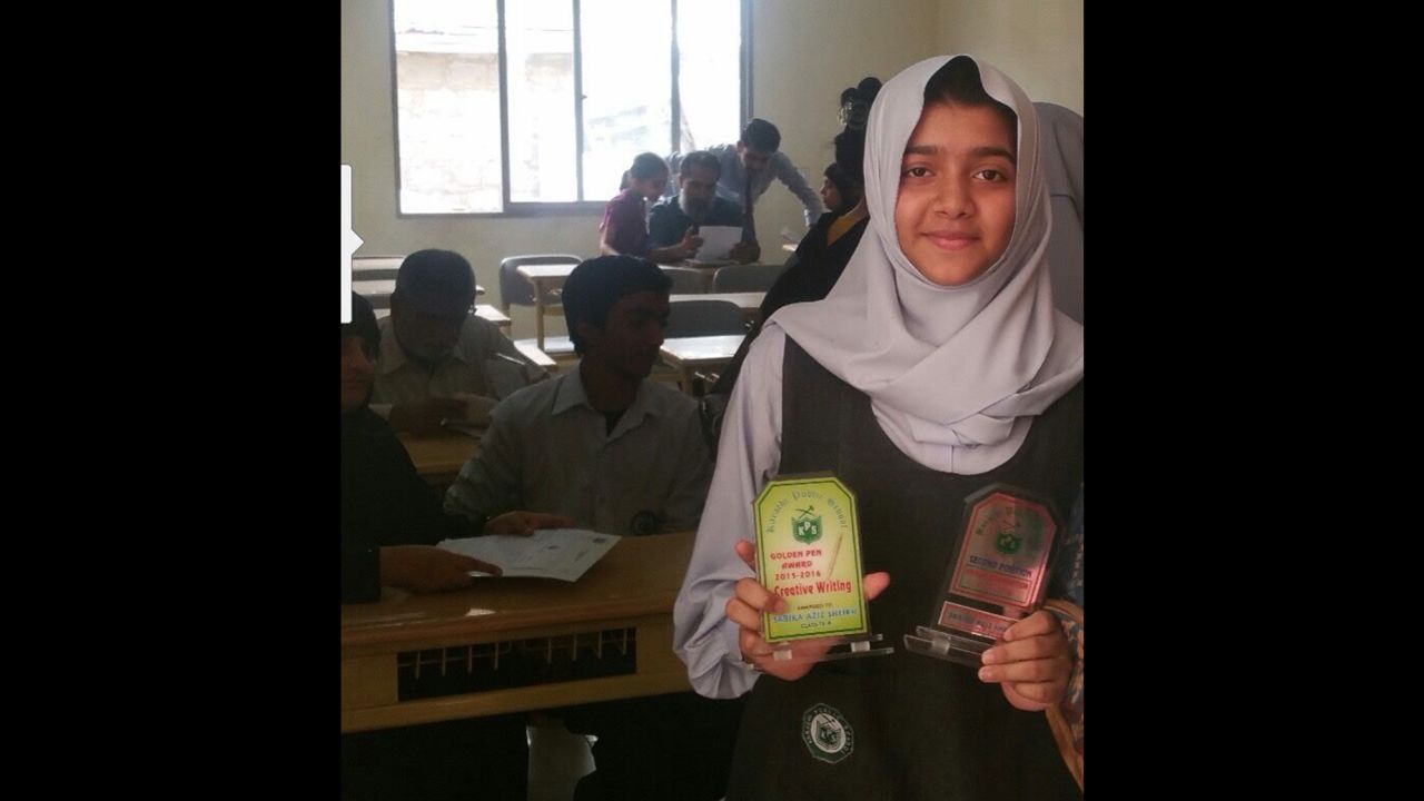 Sabika Sheikh with classmates at her school in Pakistan. The 17-year-old won an award for creative writing.