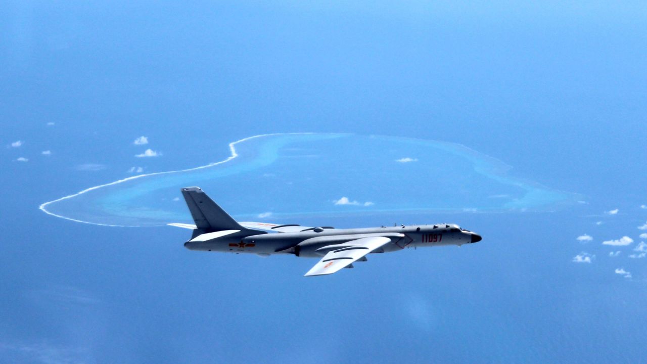 A July 2016 file photo shows a Chinese H-6K bomber patrolling islands and reefs, including Huangyan Island in the South China Sea. 