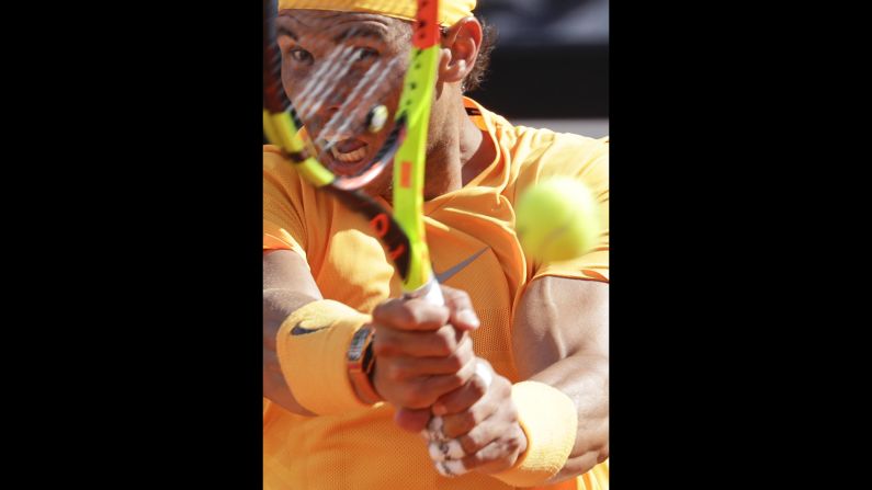 Spain's Rafael Nadal strikes a backhand to Serbia's Novak Djokovic at the Italian Open tennis tournament in Rome on Saturday, May 19. Nadal was challenged in the first set by Djokovic before pulling away for a 7-6 (4), 6-3 win to reach the final on Saturday.