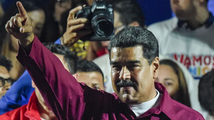 Venezuelan President Nicolas Maduro gestures after the National Electoral Council (CNE) announced the results of the voting on election day in Venezuela, on May 20, 2018. - President Nicolas Maduro was declared winner of Venezuela's election Sunday in a poll rejected as invalid by his rivals, who called for fresh elections to be held later this year. With more than 90 percent of the votes counted,  Maduro had 67.7 percent of the vote, with his main rival Henri Falcon taking 21.2 percent, the National Election Council chief Tibisay Lucena announced. (Photo by Juan BARRETO / AFP)        (Photo credit should read JUAN BARRETO/AFP/Getty Images)