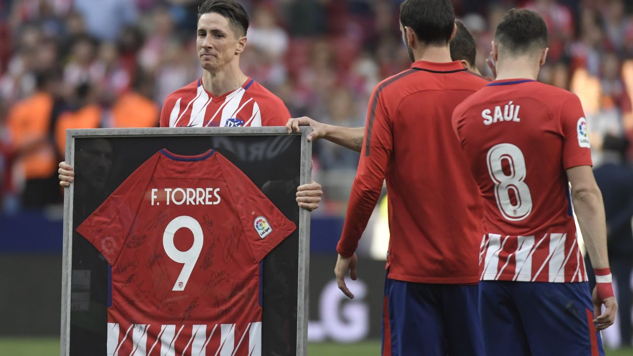 Torres was presented with a framed shirt signed by all his teammates and joined fans in a final rendition of the club's traditional anthem.