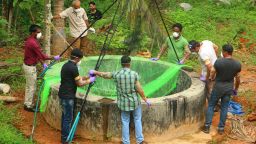 Animal Husbandry department and Forest officials inspect a well to to catch bats at Changaroth in Kozhikode in the Indian state of Kerala on May 21, 2018. - A deadly virus carried mainly by fruit bats has killed at least three people in southern India, sparking a statewide health alert May 21. Eight other deaths in the state of Kerala are being investigated for possible links to the Nipah virus, which has a 70 percent mortality rate. (Photo by - / AFP)        (Photo credit should read -/AFP/Getty Images)