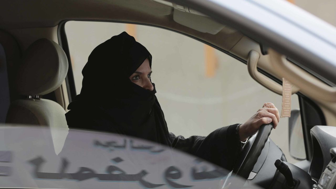 In a 2014 file photo, Aziza al-Yousef drives a car in Riyadh as part of a campaign to defy the driving ban. 