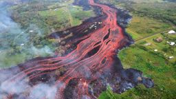 In this Saturday, May 19, 2018, photo released by the U.S. Geological Survey, lava flows from fissures near Pahoa, Hawaii. Kilauea volcano began erupting more than two weeks ago and has burned dozens of homes, forced people to flee and shot up plumes of steam from its summit that led officials to distribute face masks to protect against ash particles. (U.S. Geological Survey via AP)